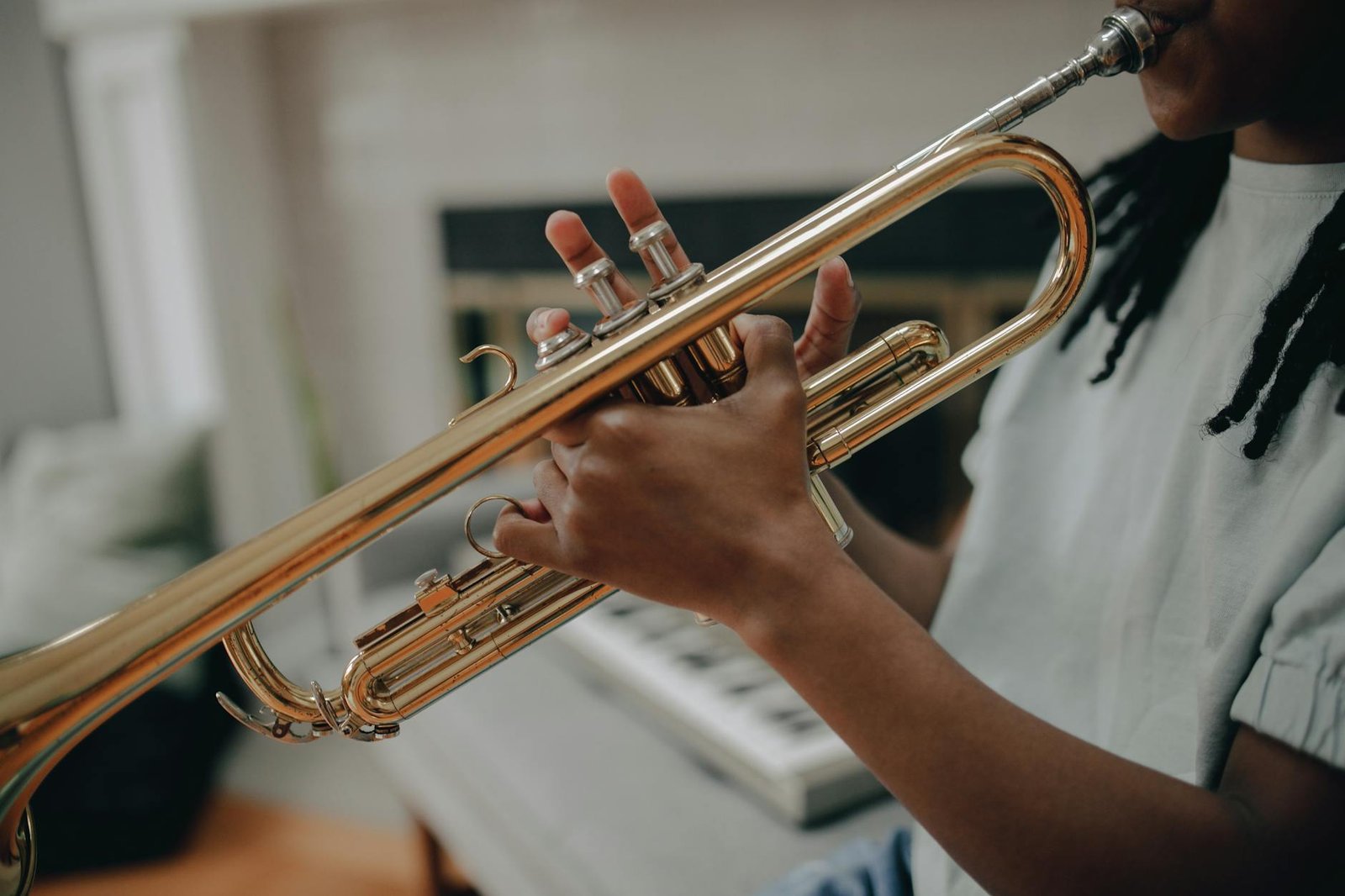 a kid playing brass trumpet
